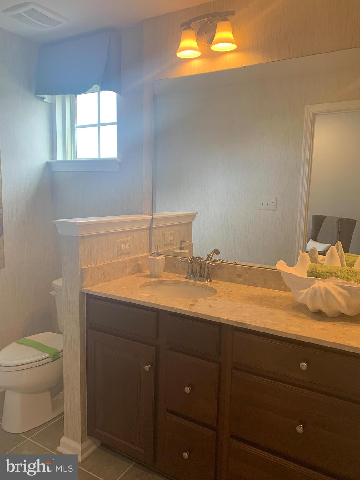 6491 Jack Linton Drive South Frederick, MD 21703 - Photo 11 of 24 a bathroom with a toilet sink and mirror