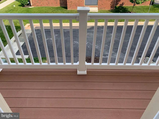 a balcony view with a bench