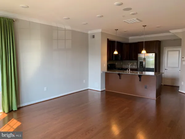 a view of a kitchen cabinets and wooden floor