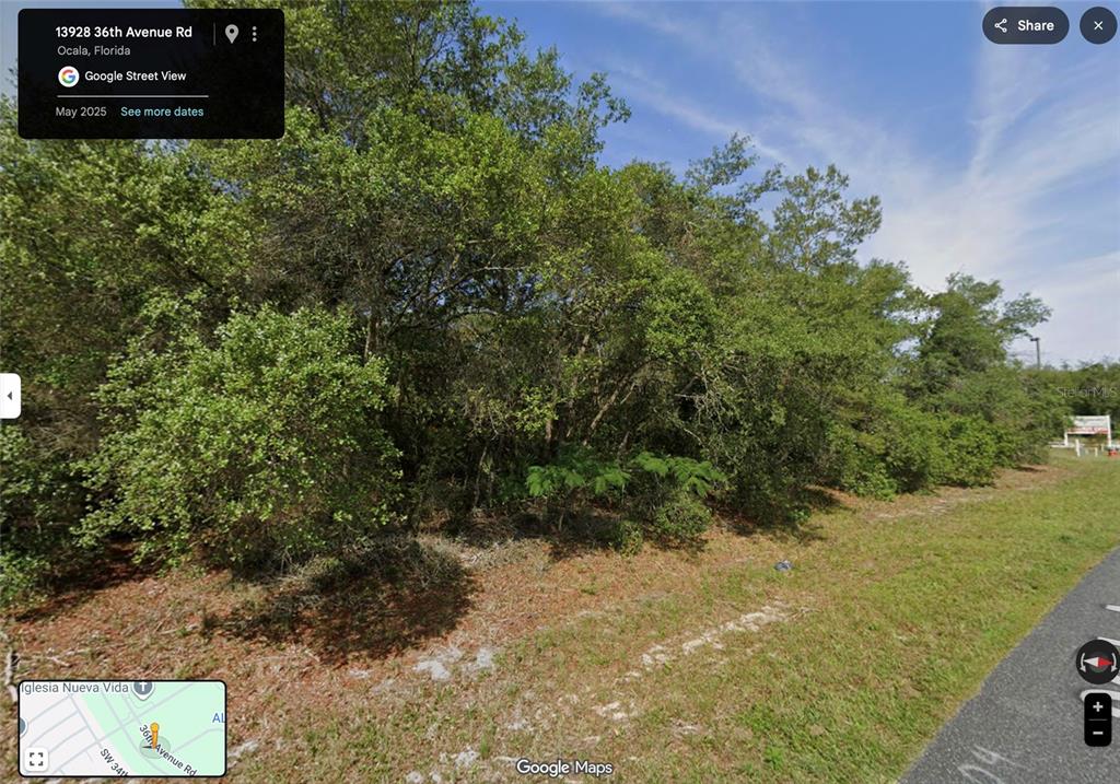 Southwest 36th Avenue Road Ocala, FL 34473 - Photo 4 of 5 a view of a pathway both side of grassy field with trees