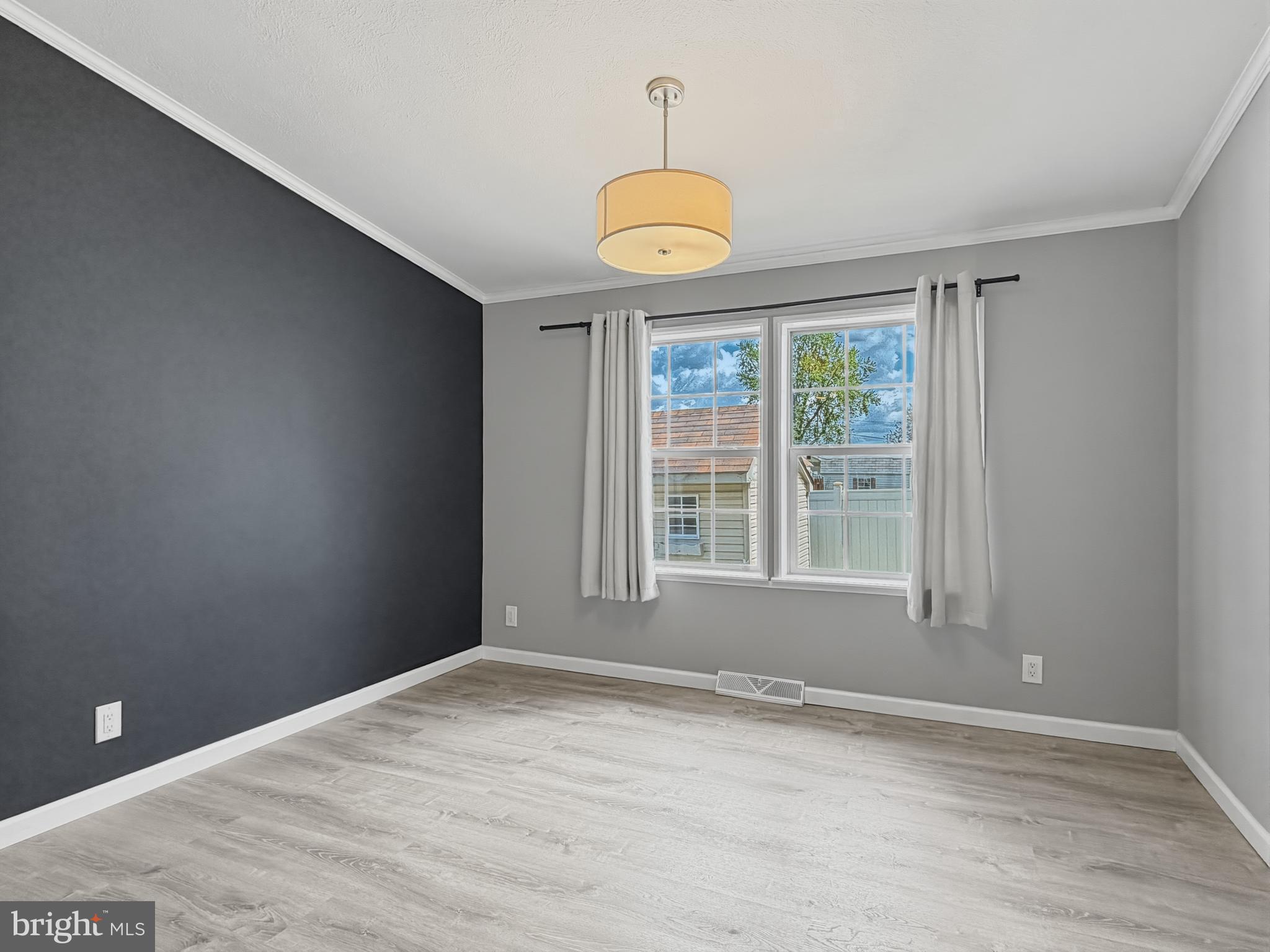 1137 2nd Avenue Croydon, PA 19021 - Photo 15 of 37 an empty room with wooden floor and windows