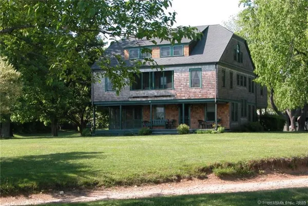 a backyard of a house with lots of green space