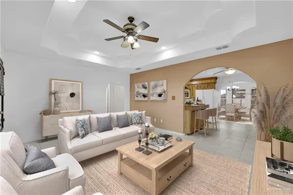 a large white kitchen with a large window cabinets and stainless steel appliances