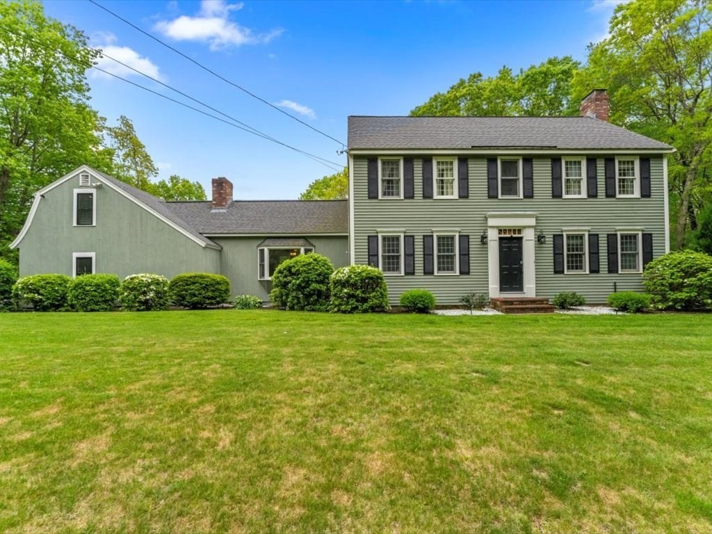157 Harvard Road Bolton, MA 01740 - Photo 1 of 42 a front view of a house with a yard