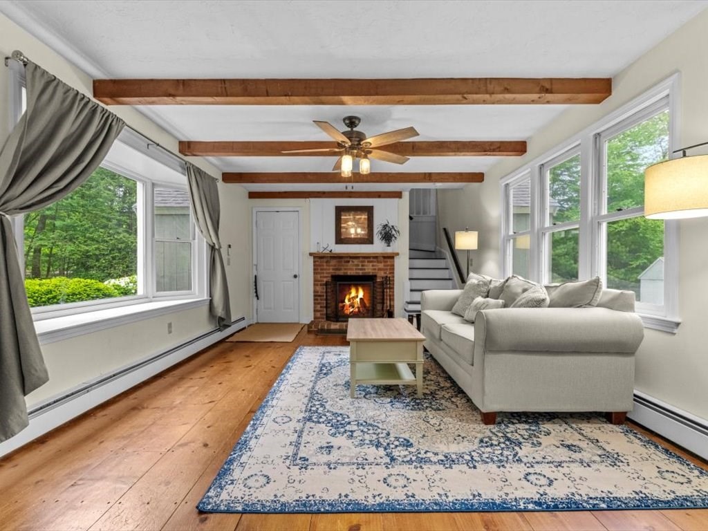 157 Harvard Road Bolton, MA 01740 - Photo 16 of 42 a living room with furniture and a fireplace