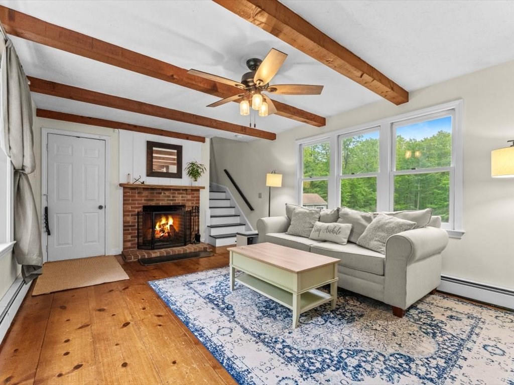 157 Harvard Road Bolton, MA 01740 - Photo 17 of 42 a living room with furniture and a fireplace