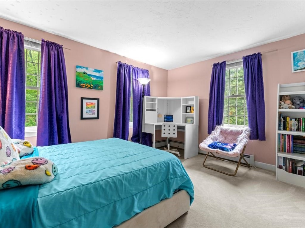 157 Harvard Road Bolton, MA 01740 - Photo 26 of 42 a bedroom with a bed and a chair