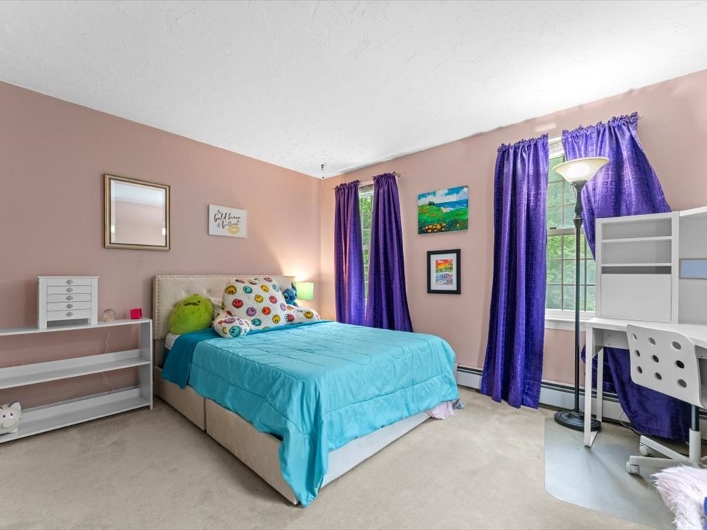 157 Harvard Road Bolton, MA 01740 - Photo 27 of 42 a bedroom with a bed and a bed
