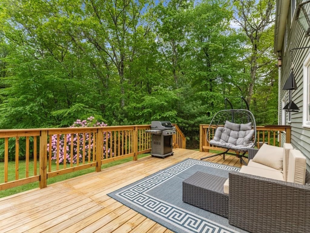 157 Harvard Road Bolton, MA 01740 - Photo 37 of 42 a view of a balcony with chairs