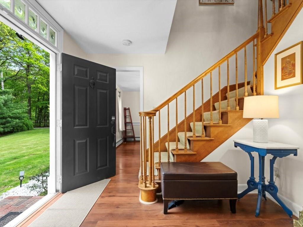 157 Harvard Road Bolton, MA 01740 - Photo 4 of 42 a view of entryway and hall with wooden floor