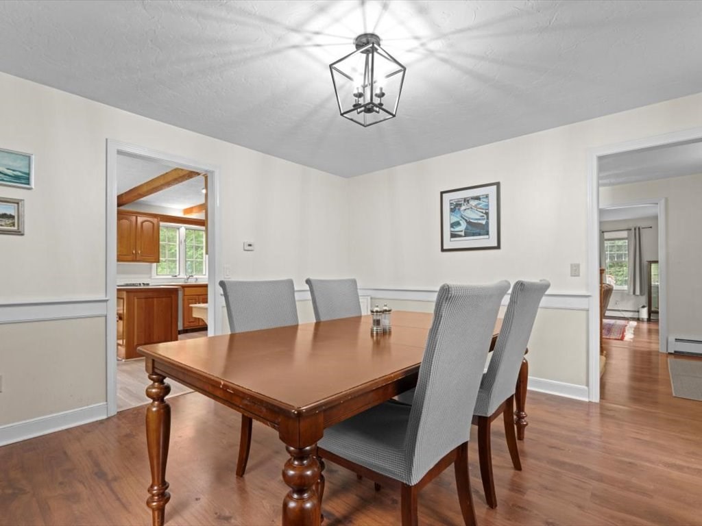 157 Harvard Road Bolton, MA 01740 - Photo 8 of 42 a view of a dining room with furniture and wooden floor