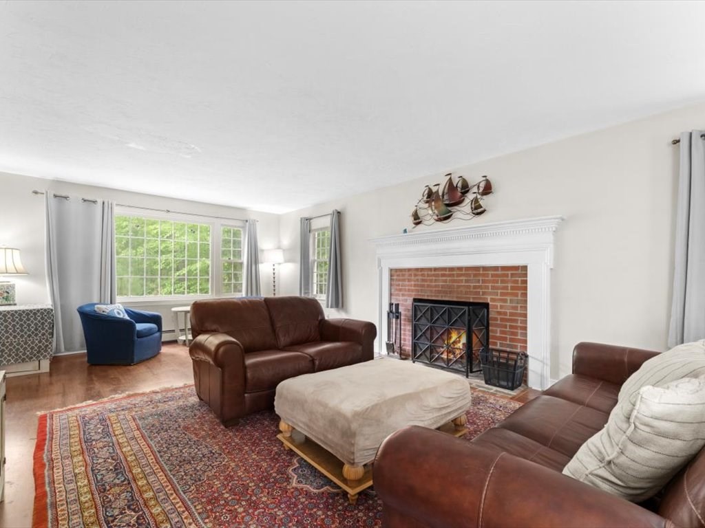 157 Harvard Road Bolton, MA 01740 - Photo 9 of 42 a living room with furniture and a fireplace