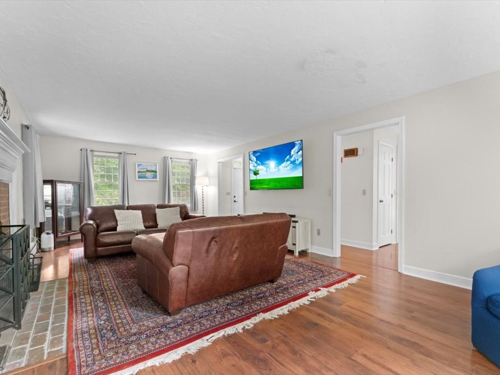 157 Harvard Road Bolton, MA 01740 - Photo 10 of 42 a living room with furniture and a wooden floor