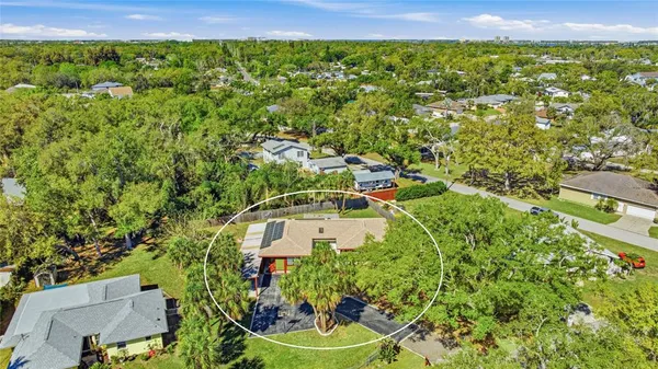 an aerial view of a house with a lake view