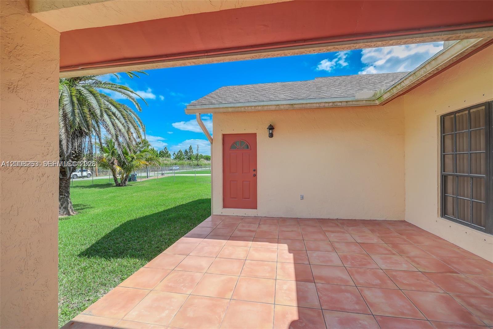 19900 Southwest 326th Street, Unit 1 Homestead, FL 33030 - Photo 9 of 11 a view of backyard with cabin