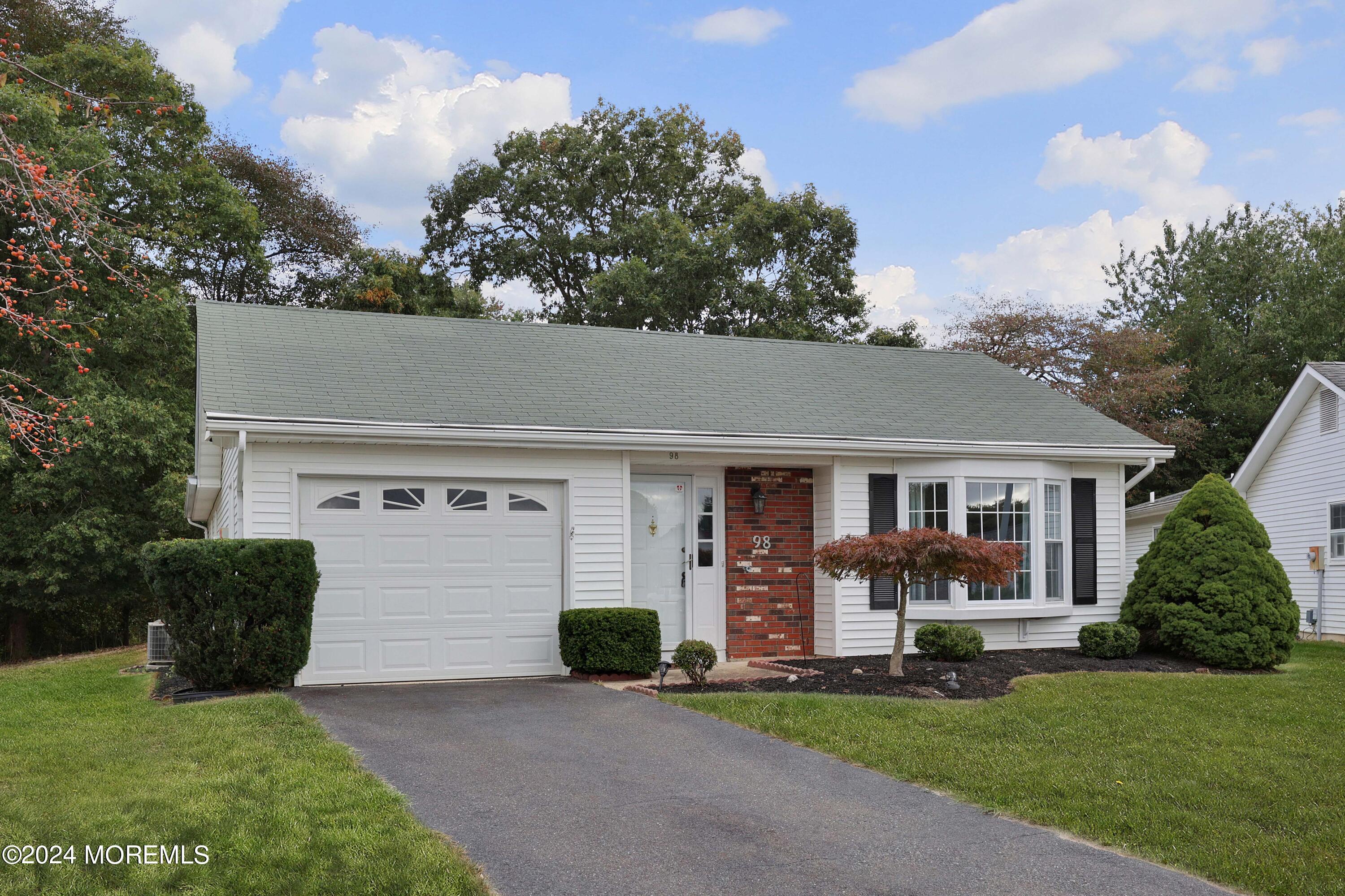 98 Greenbriar Boulevard Brick, NJ 08724 - Photo 2 of 31 front view of a house with a yard