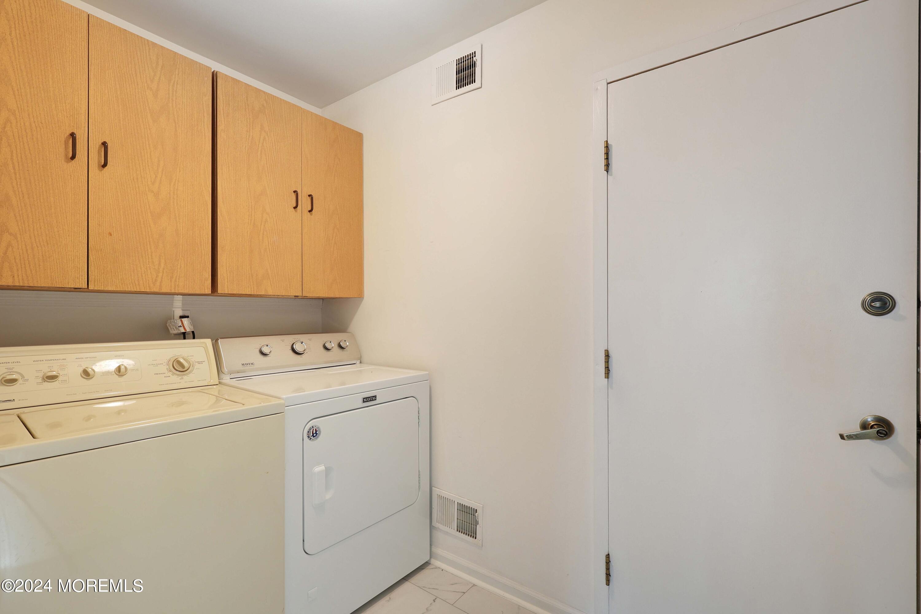 98 Greenbriar Boulevard Brick, NJ 08724 - Photo 25 of 31 a utility room with dryer and washer