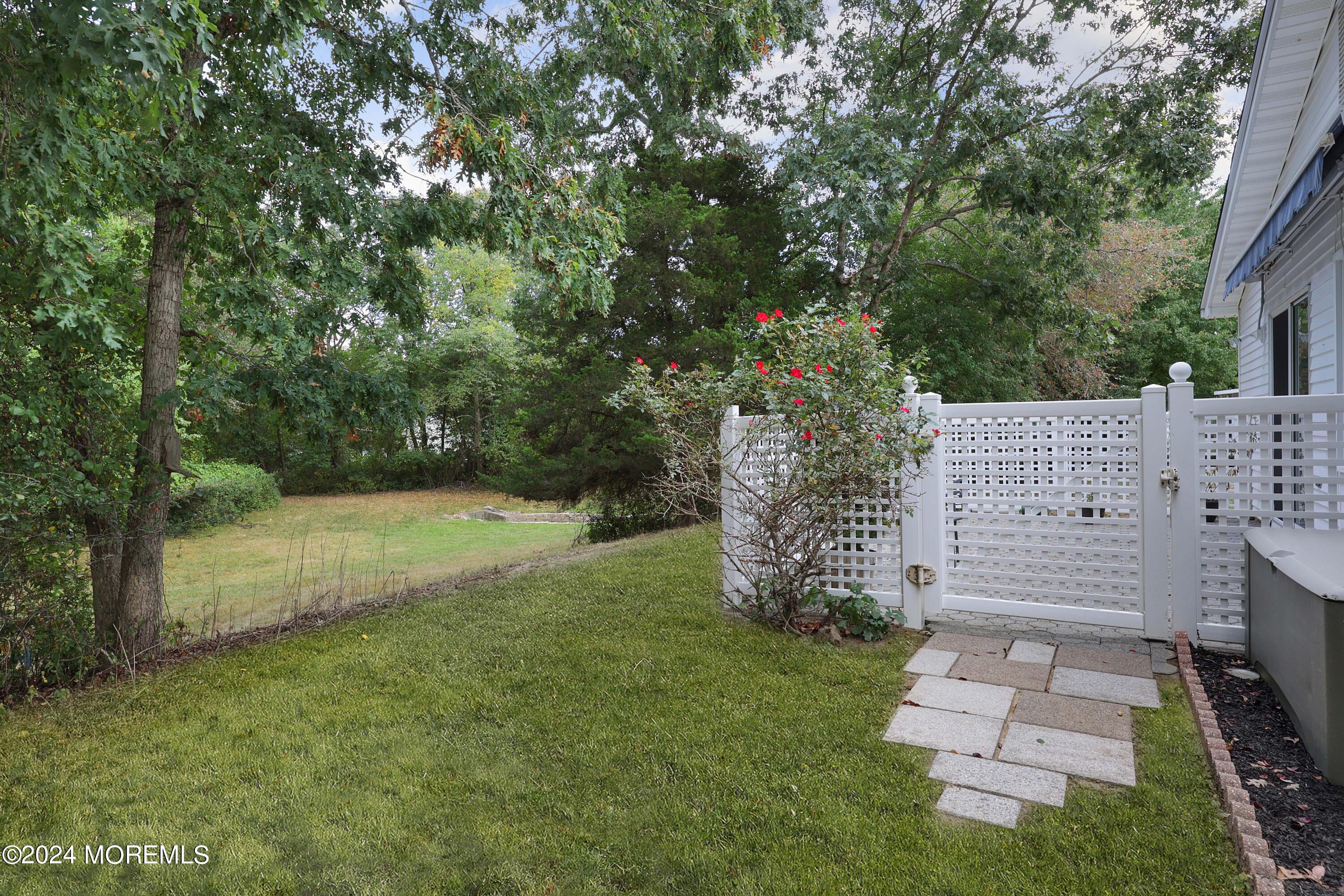 98 Greenbriar Boulevard Brick, NJ 08724 - Photo 27 of 31 a view of a yard