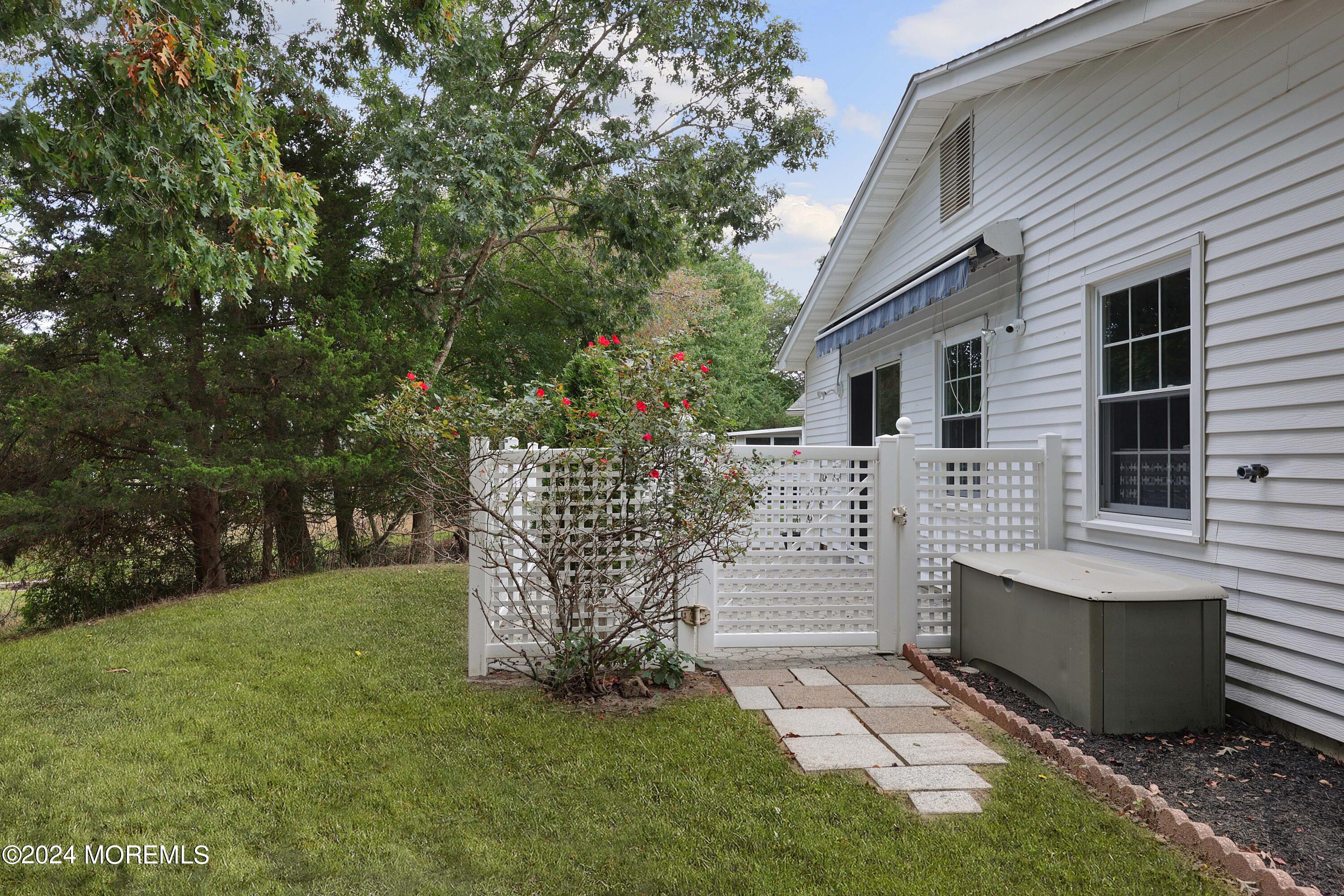 98 Greenbriar Boulevard Brick, NJ 08724 - Photo 29 of 31 a view of house with backyard and a garden
