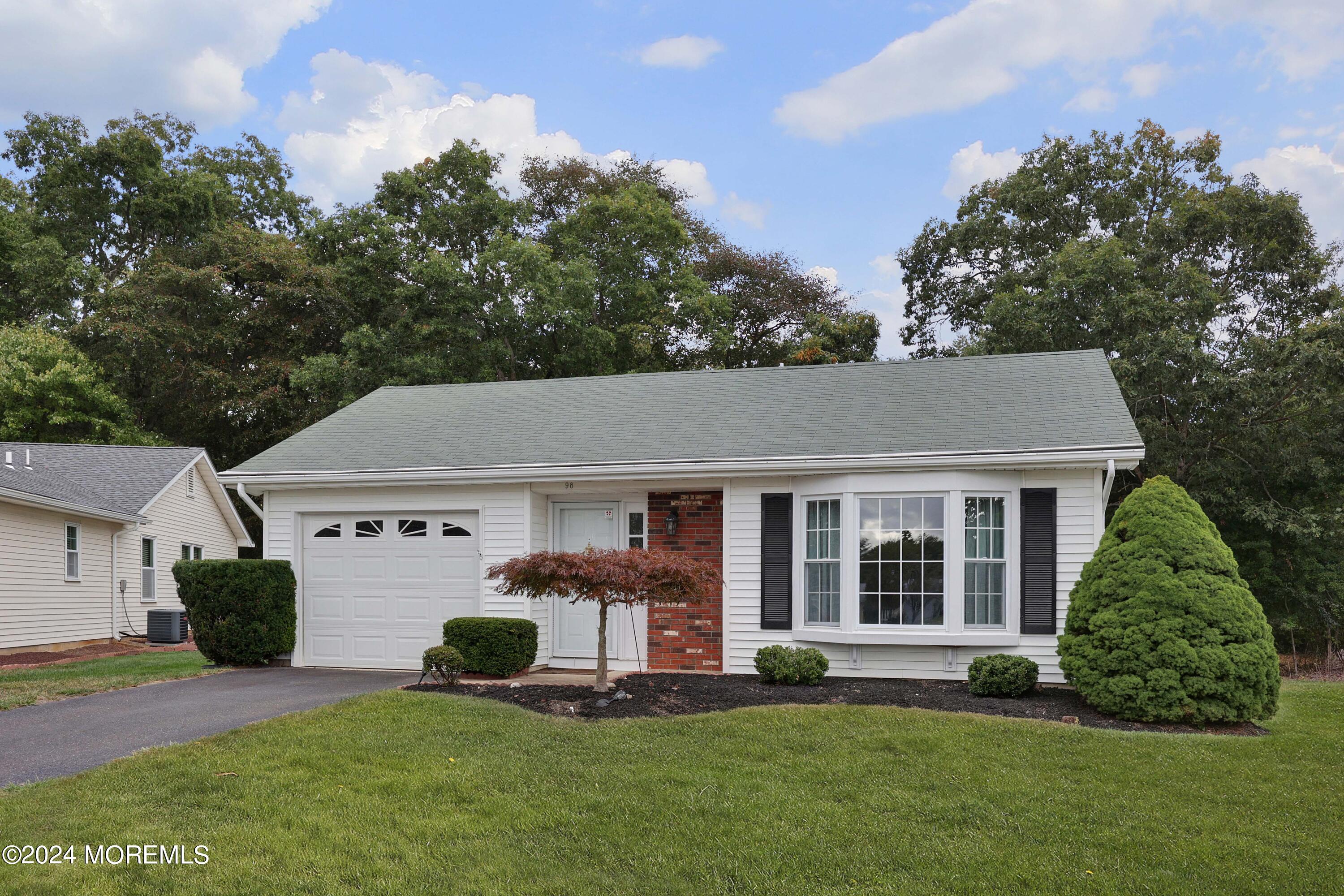 98 Greenbriar Boulevard Brick, NJ 08724 - Photo 3 of 31 a front view of a house with a yard