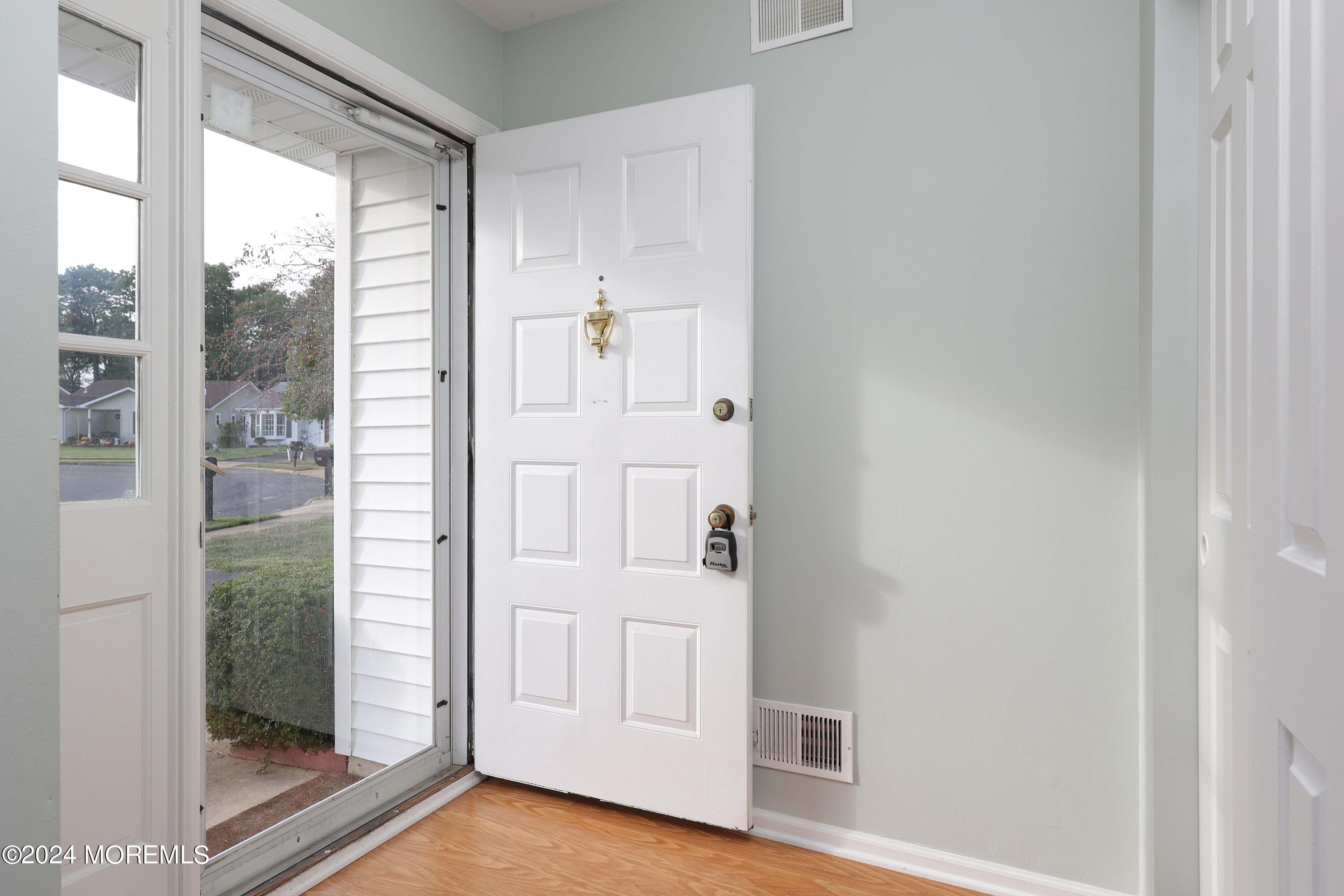 98 Greenbriar Boulevard Brick, NJ 08724 - Photo 5 of 31 a view of front door with hallway