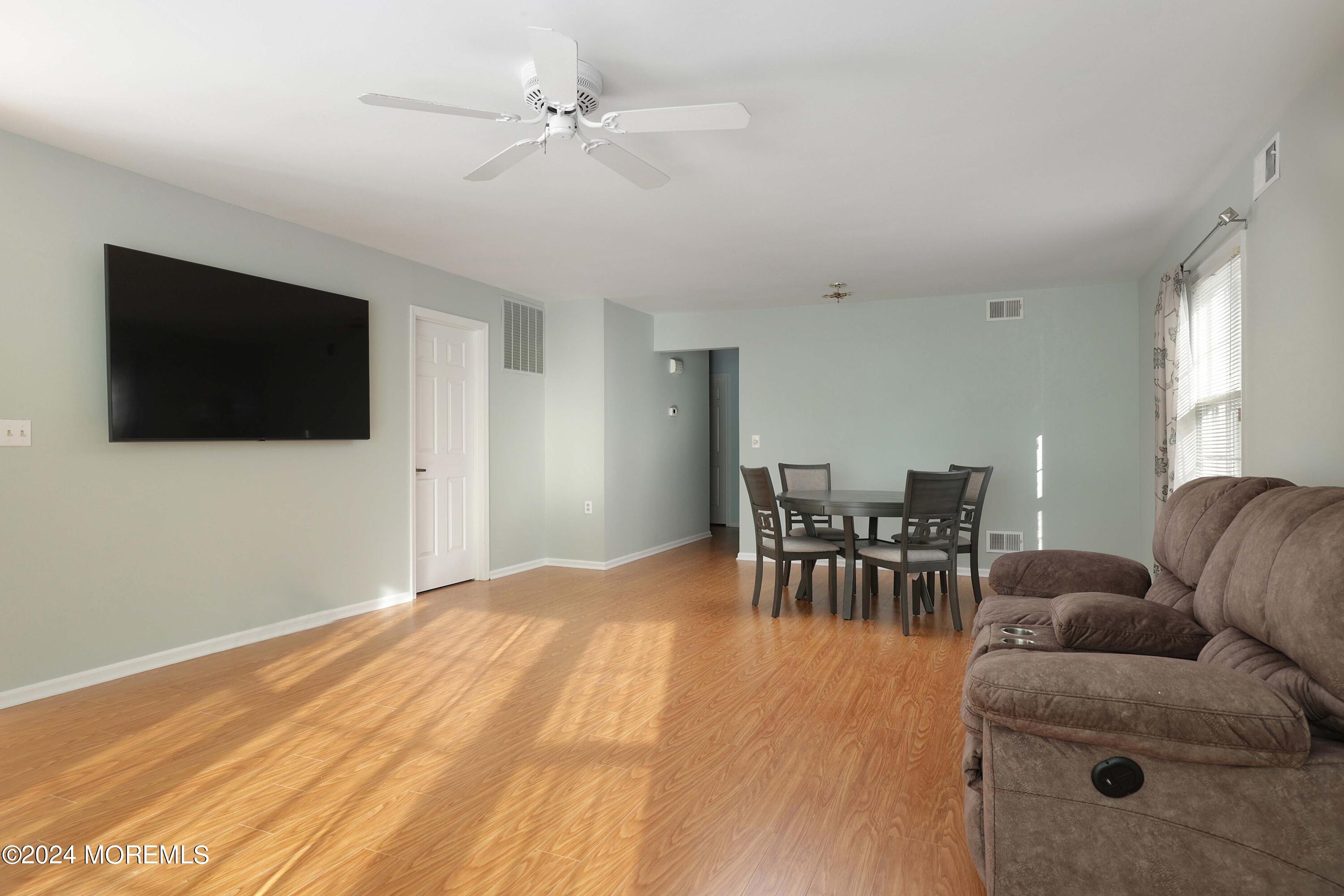 98 Greenbriar Boulevard Brick, NJ 08724 - Photo 6 of 31 a living room with furniture and a flat screen tv