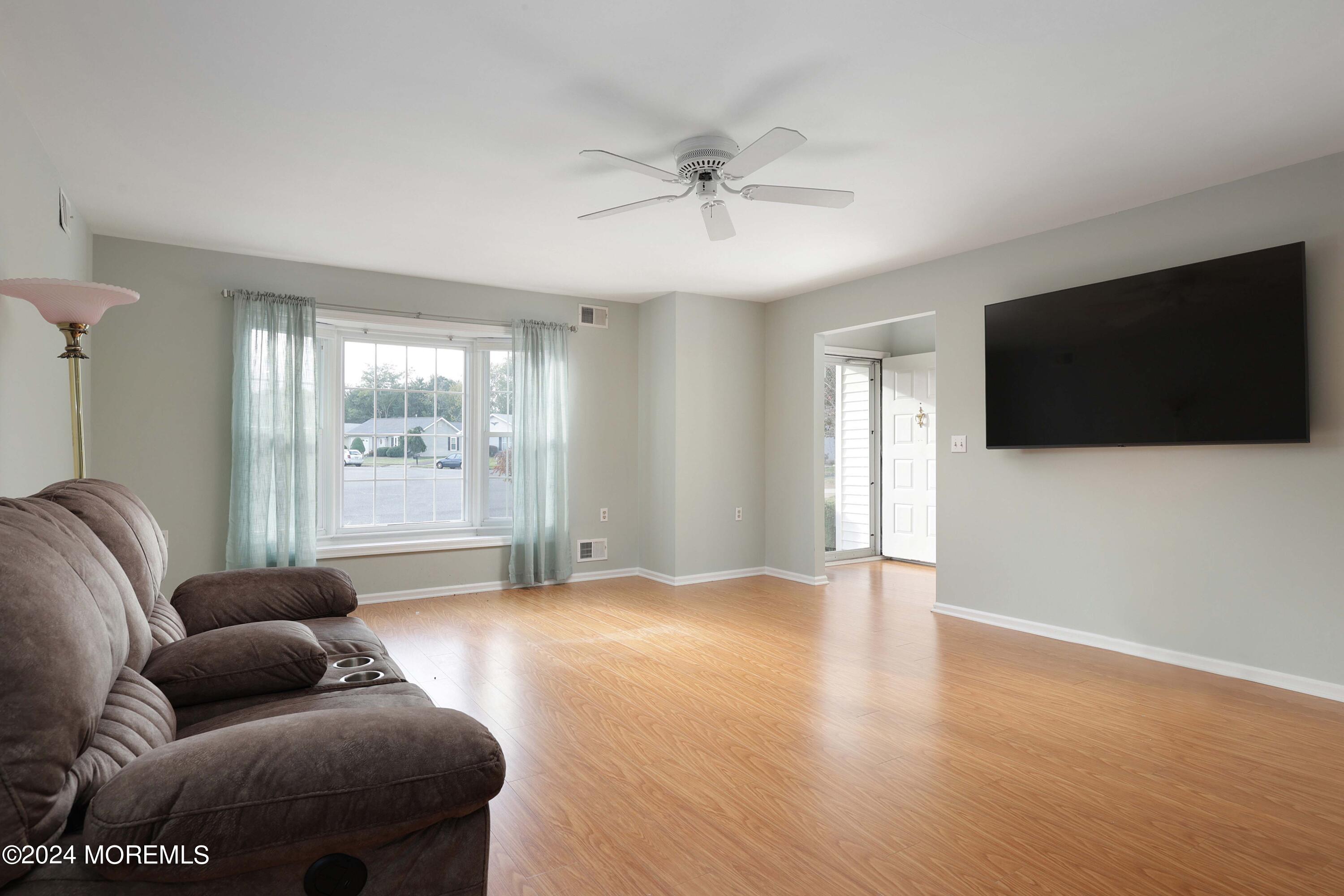 98 Greenbriar Boulevard Brick, NJ 08724 - Photo 7 of 31 a living room with furniture and a flat screen tv