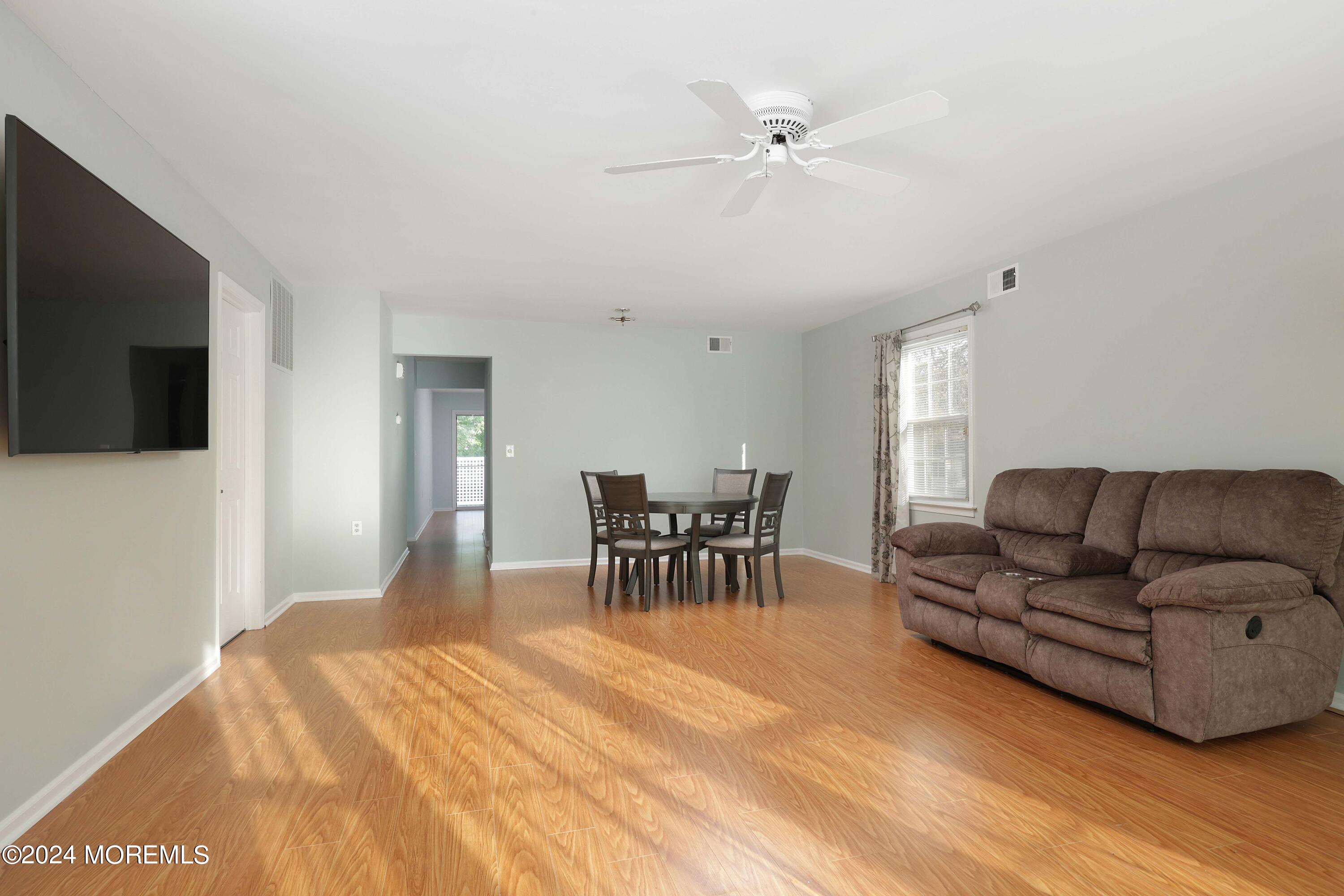 98 Greenbriar Boulevard Brick, NJ 08724 - Photo 8 of 31 a living room with furniture and a flat screen tv