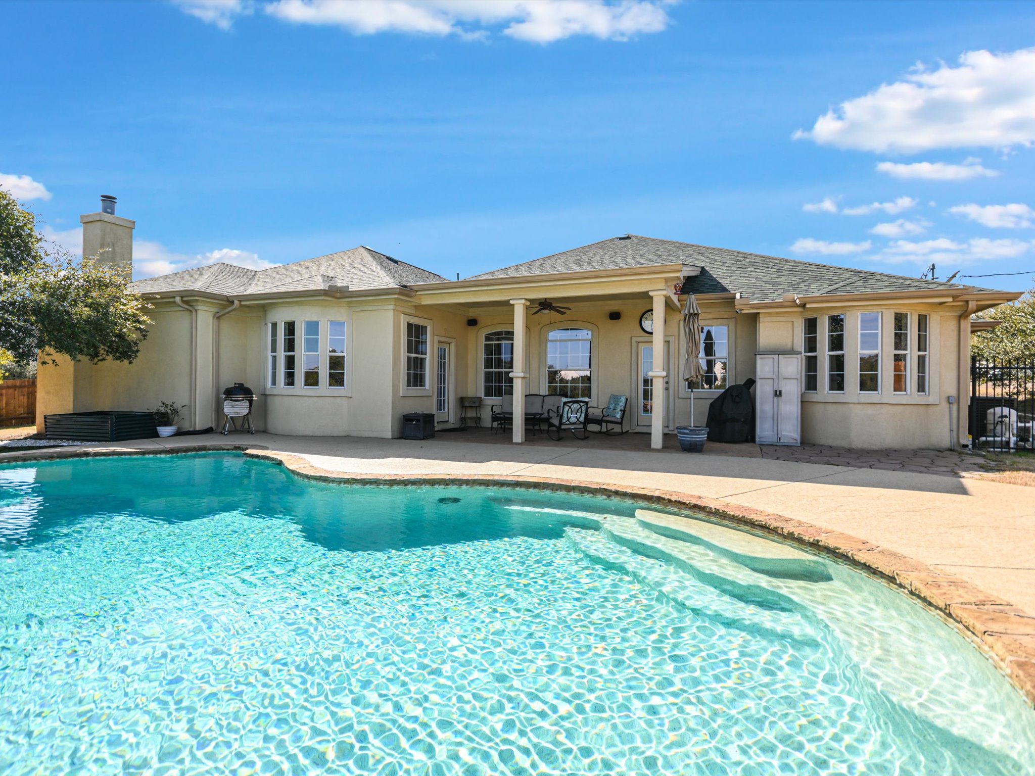 10111 Baxter Lane Austin, TX 78736 - Photo 2 of 35 a view of a house with swimming pool and a yard