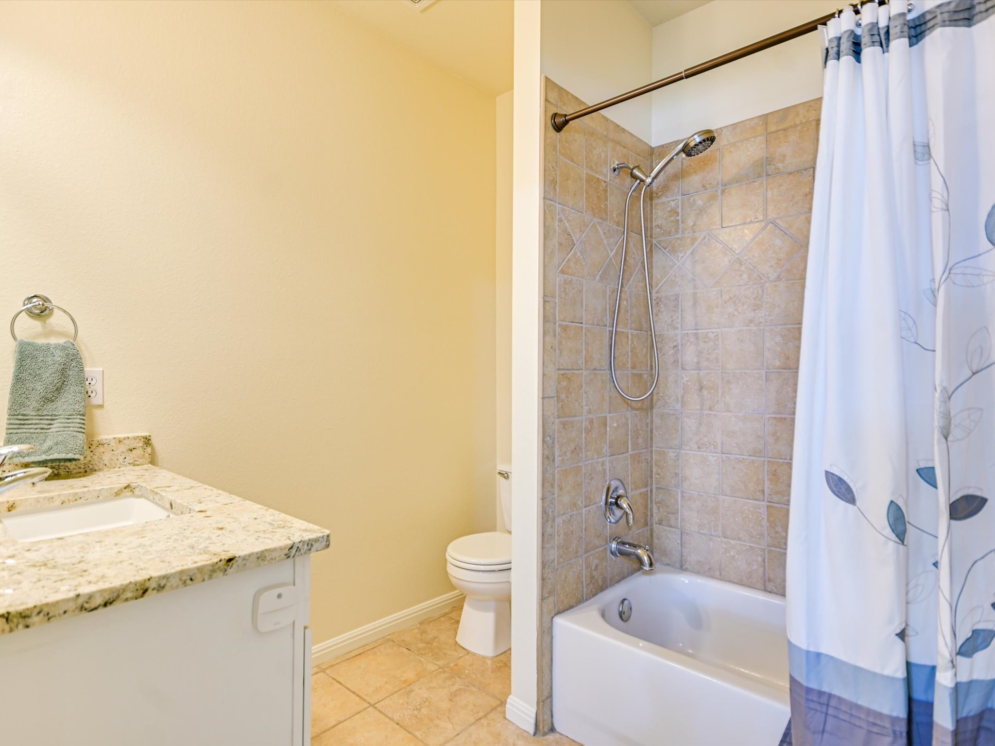10111 Baxter Lane Austin, TX 78736 - Photo 21 of 35 a bathroom with a granite countertop sink a toilet and shower