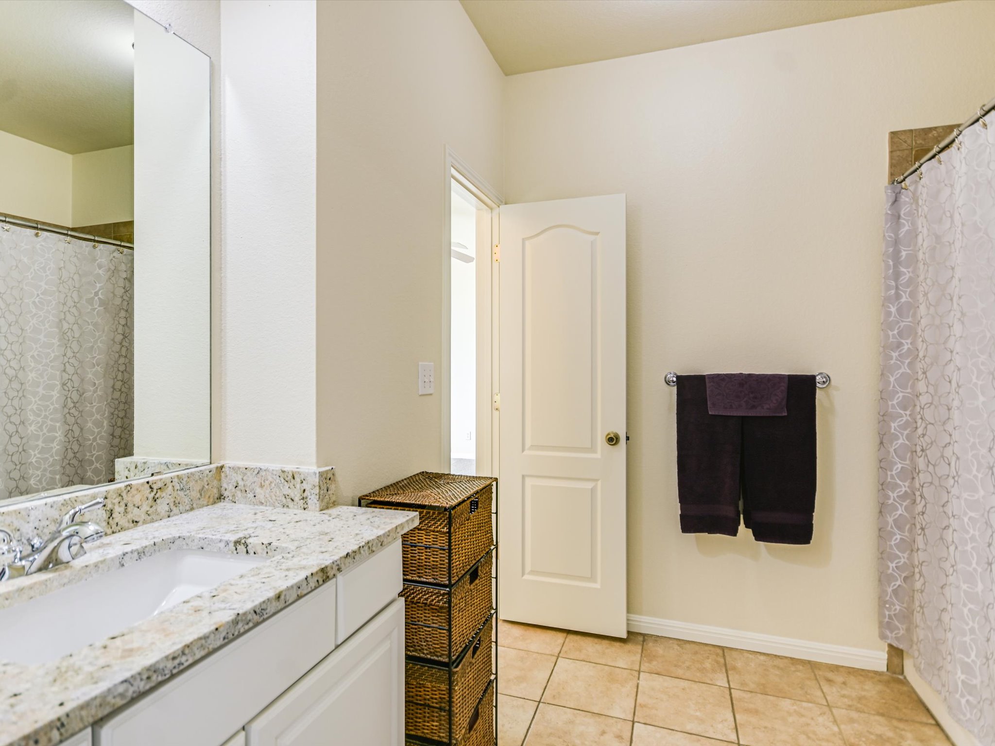 10111 Baxter Lane Austin, TX 78736 - Photo 24 of 35 a bathroom with a sink and a mirror
