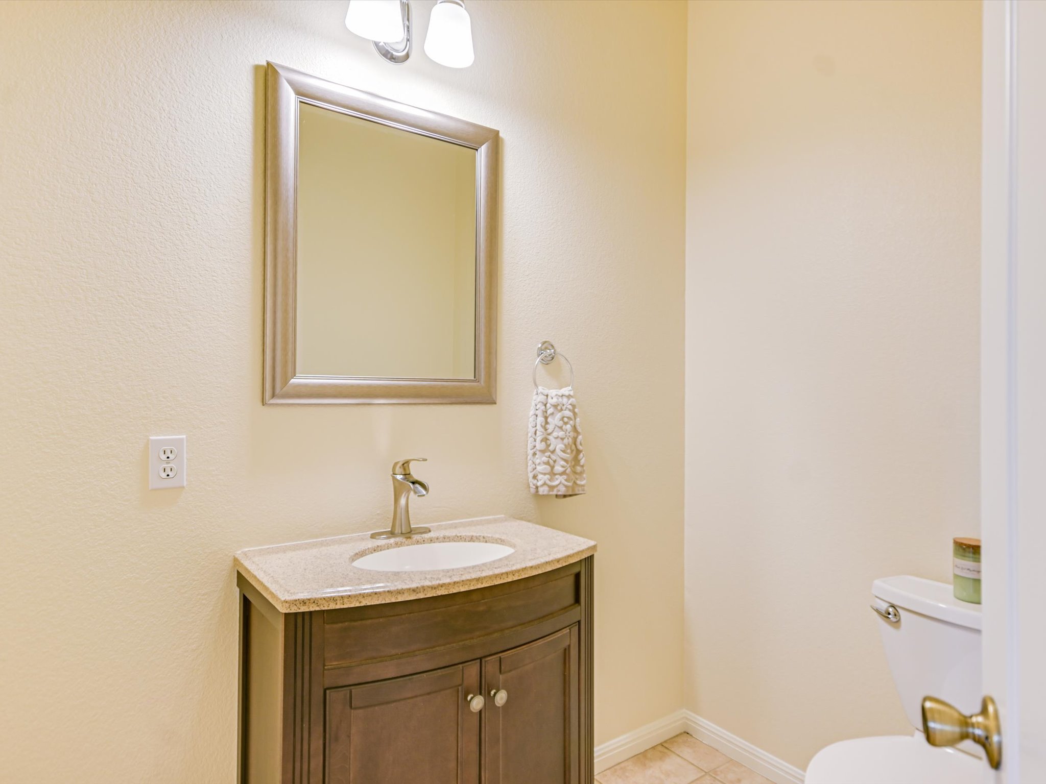 10111 Baxter Lane Austin, TX 78736 - Photo 27 of 35 a bathroom with a sink a toilet and mirror