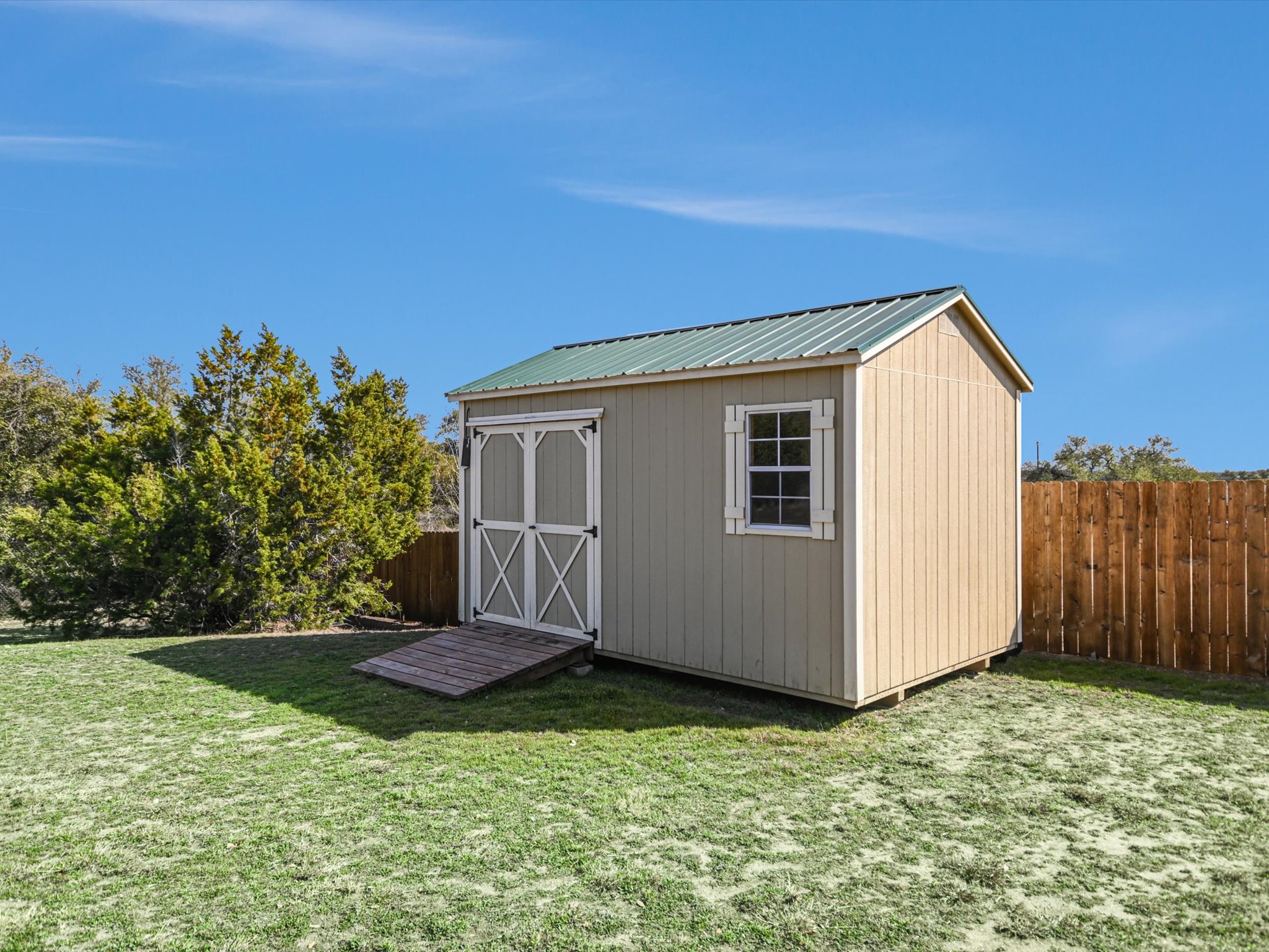 10111 Baxter Lane Austin, TX 78736 - Photo 29 of 35 a house view with a backyard space