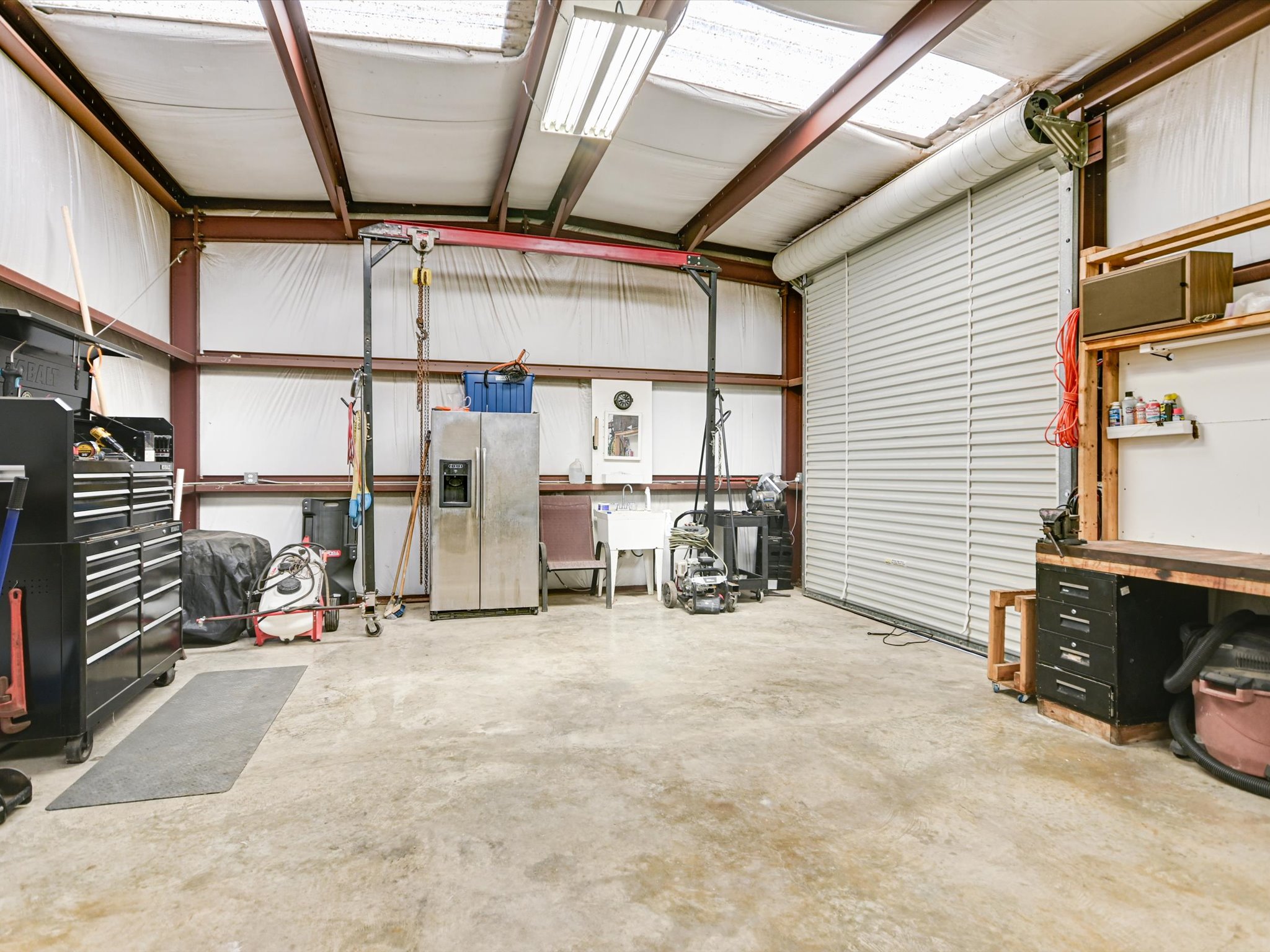 10111 Baxter Lane Austin, TX 78736 - Photo 33 of 35 a view of a storage room with furniture and a large window