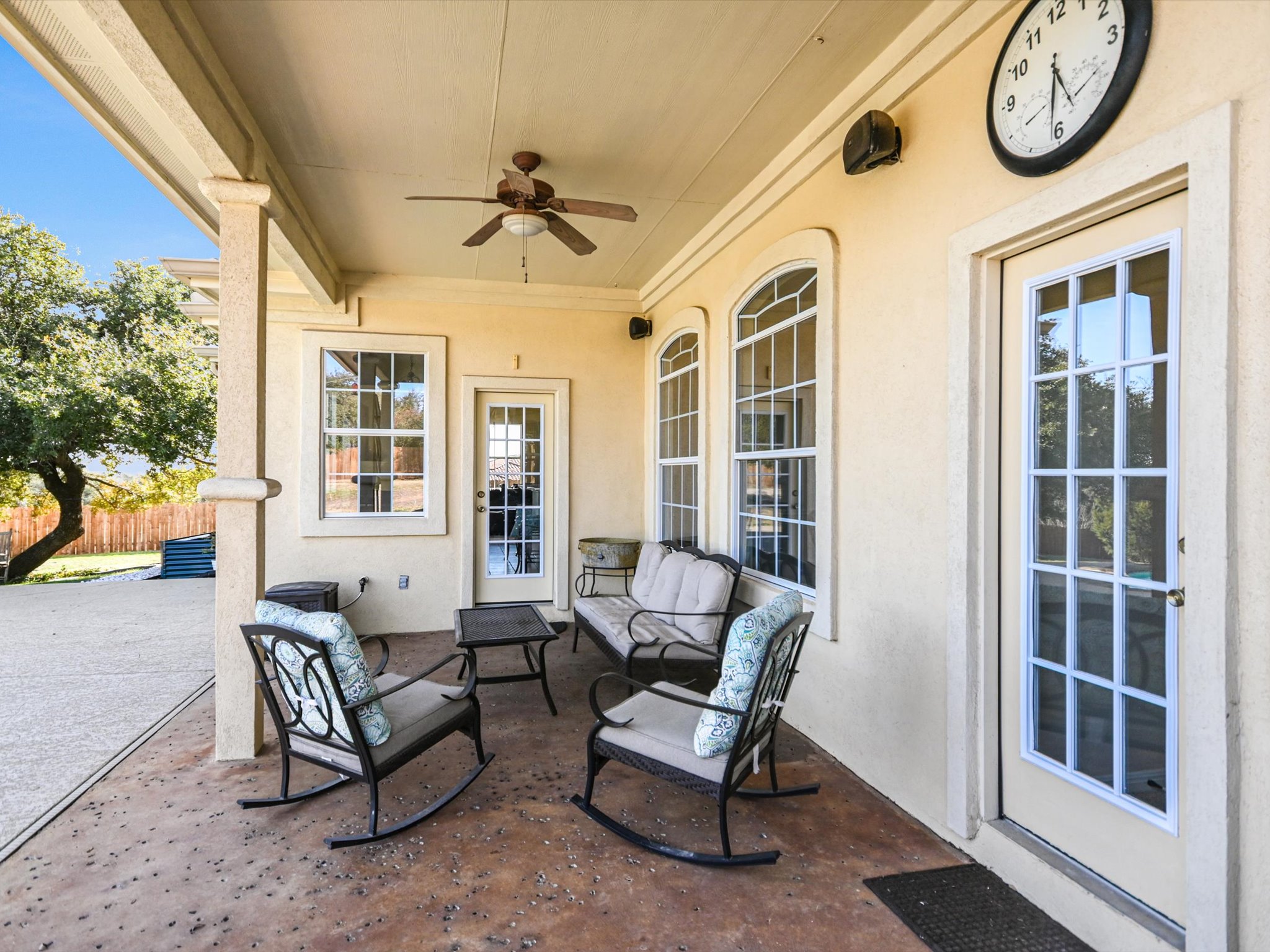 10111 Baxter Lane Austin, TX 78736 - Photo 34 of 35 a living room with furniture a clock and a window