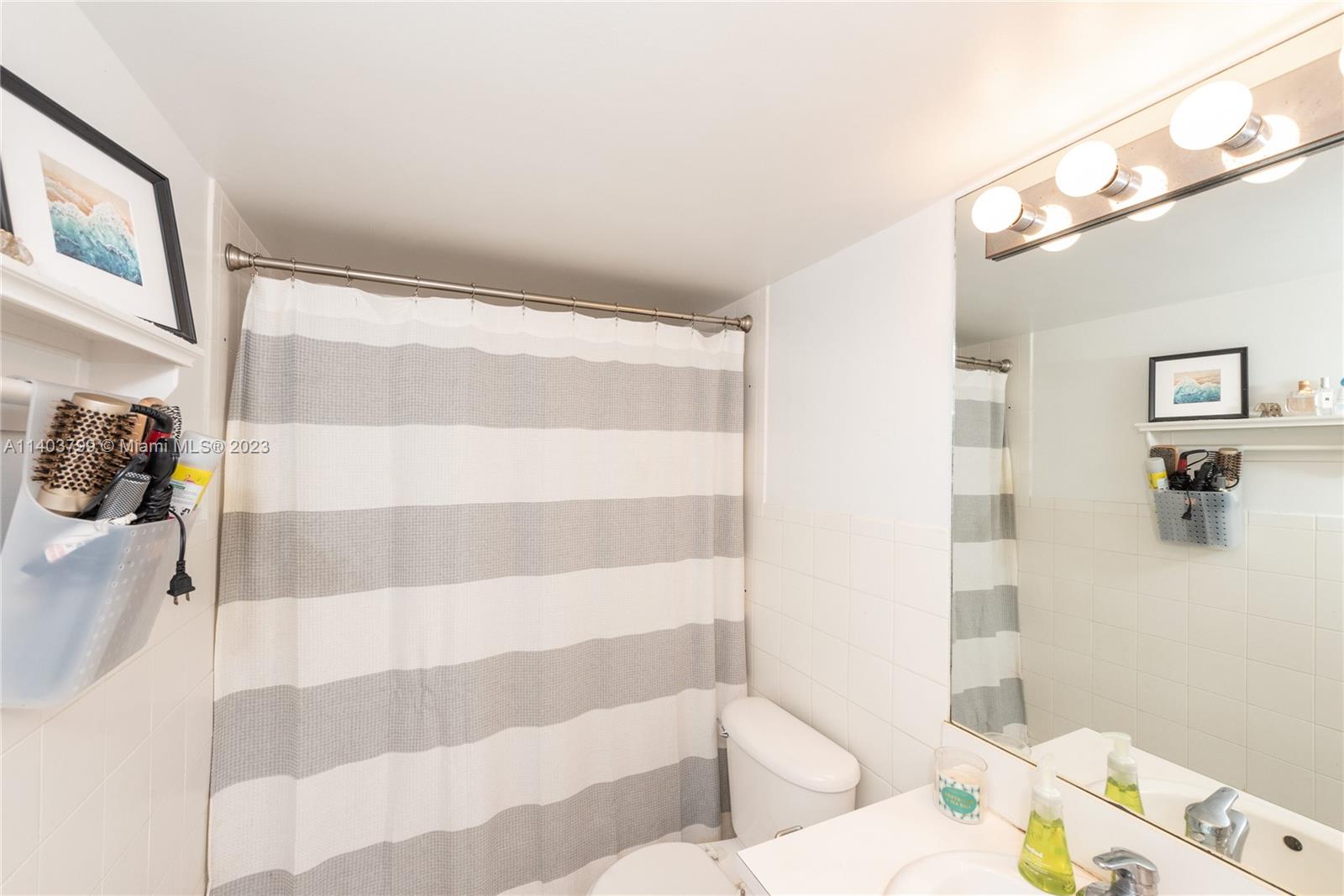 1401 Bay Road, Unit 503 Miami Beach, FL 33139 - Photo 17 of 18 a bathroom with a sink and a shower