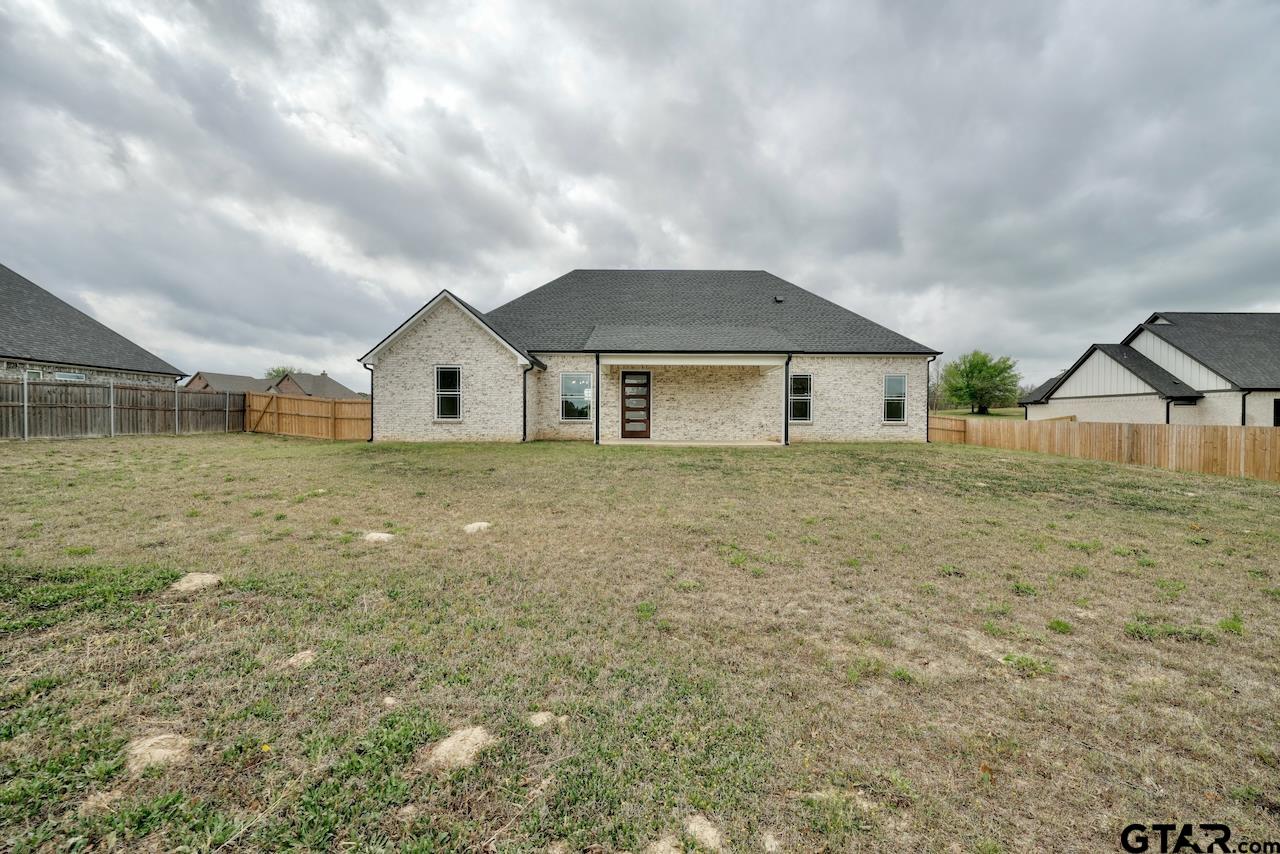 19383 Ridge Point Circle Lindale, TX 75771 - Photo 41 of 48 a house with lots of trees in the background
