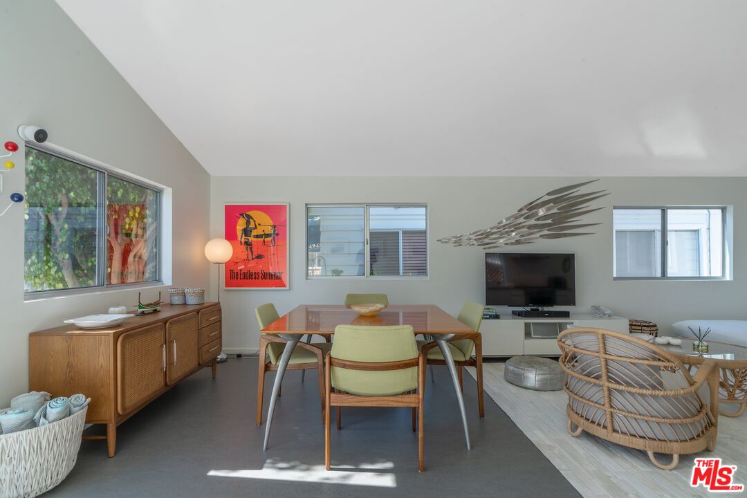 29 Paradise Cove Road Malibu, CA 90265 - Photo 5 of 30 a living room with furniture and a flat screen tv