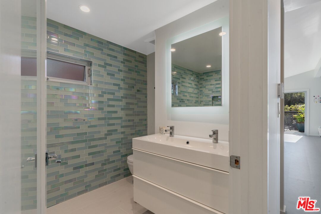 29 Paradise Cove Road Malibu, CA 90265 - Photo 7 of 30 a bathroom with a sink and a shower