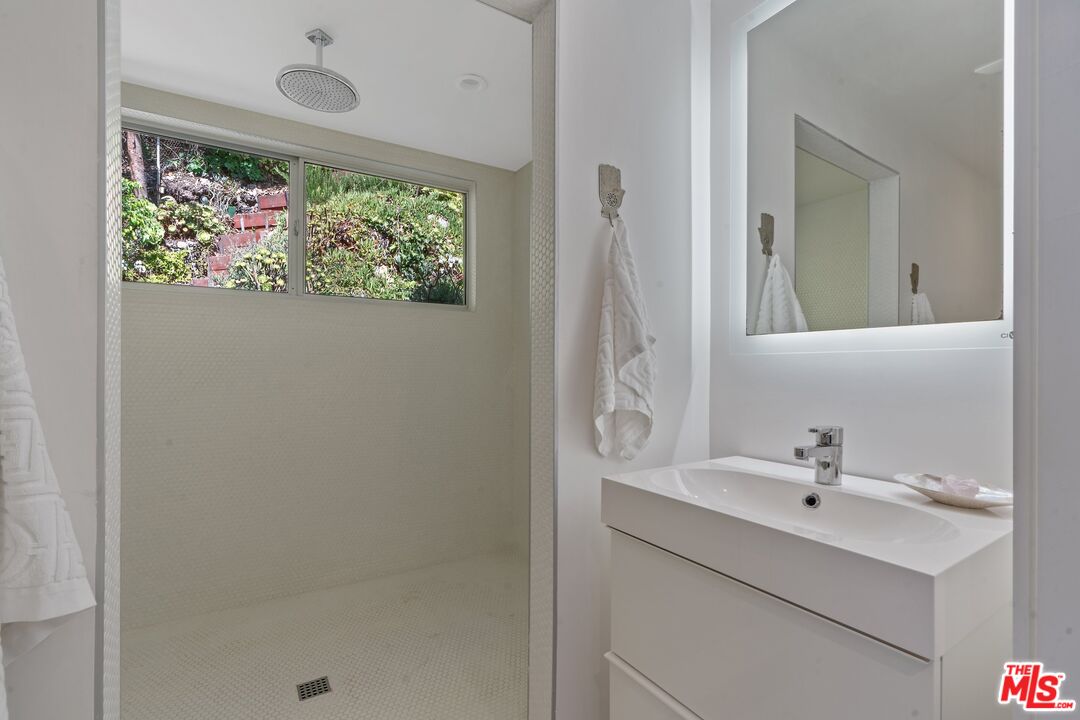 29 Paradise Cove Road Malibu, CA 90265 - Photo 10 of 30 a bathroom with a sink and a mirror