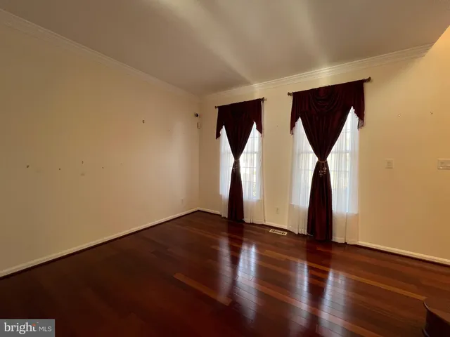a kitchen with stainless steel appliances granite countertop a stove and a wooden floors