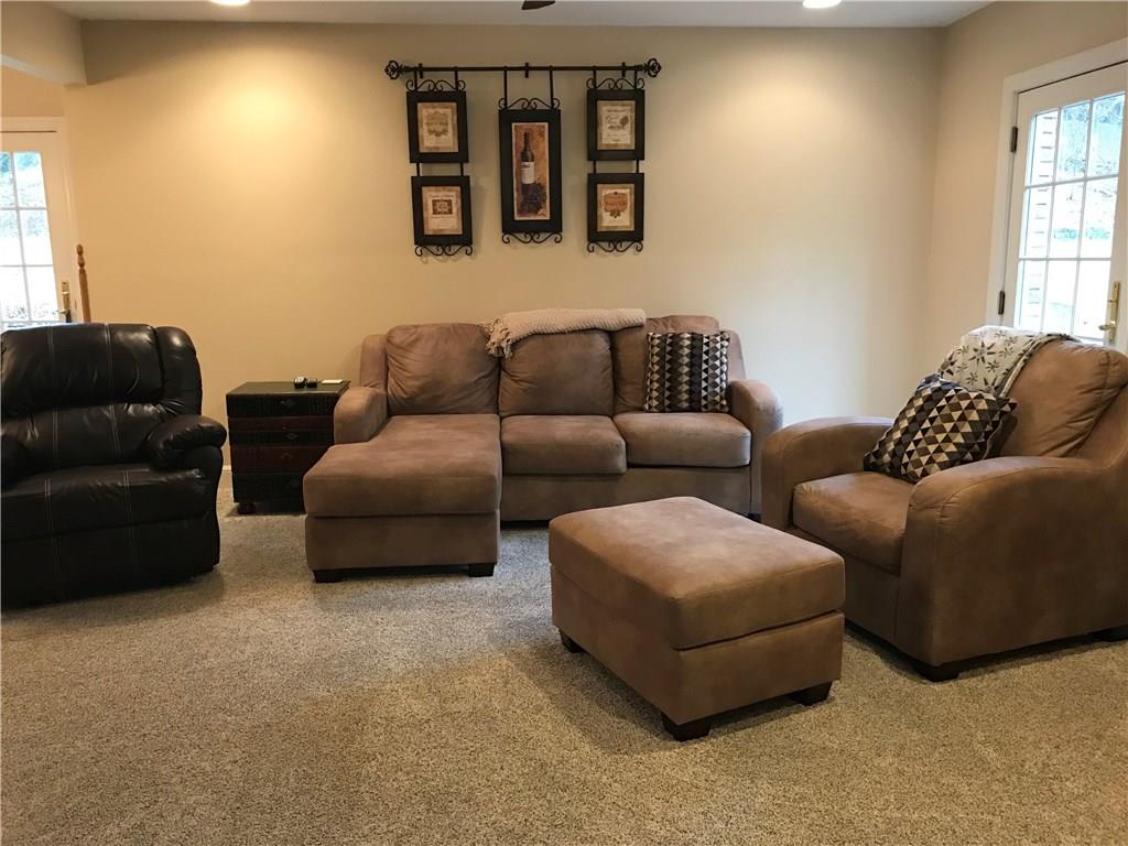 265 Rutledge Drive Canonsburg, PA 15317 - Photo 12 of 24 Family Room: Your toes will enjoy the Brand New plush Frieze carpeting. Each of the doors leads to the new wrap around patio.