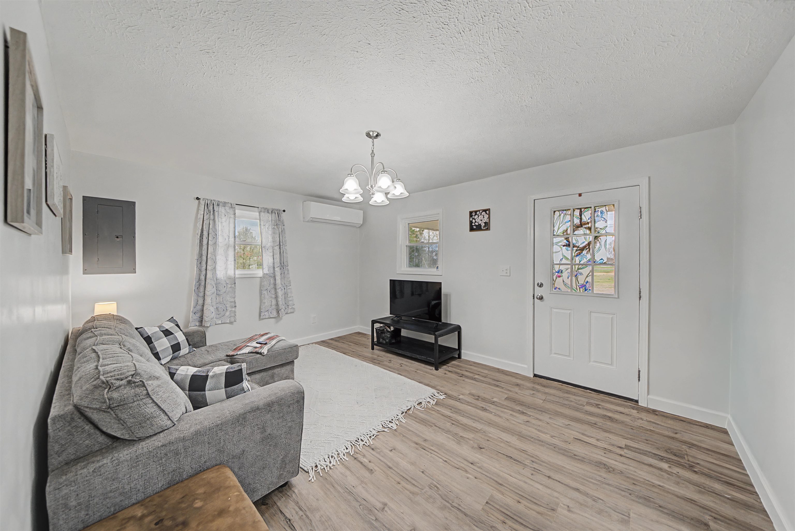 8040 45th Highway South Ramer, TN 38367 - Photo 11 of 20 a living room with furniture and a chandelier