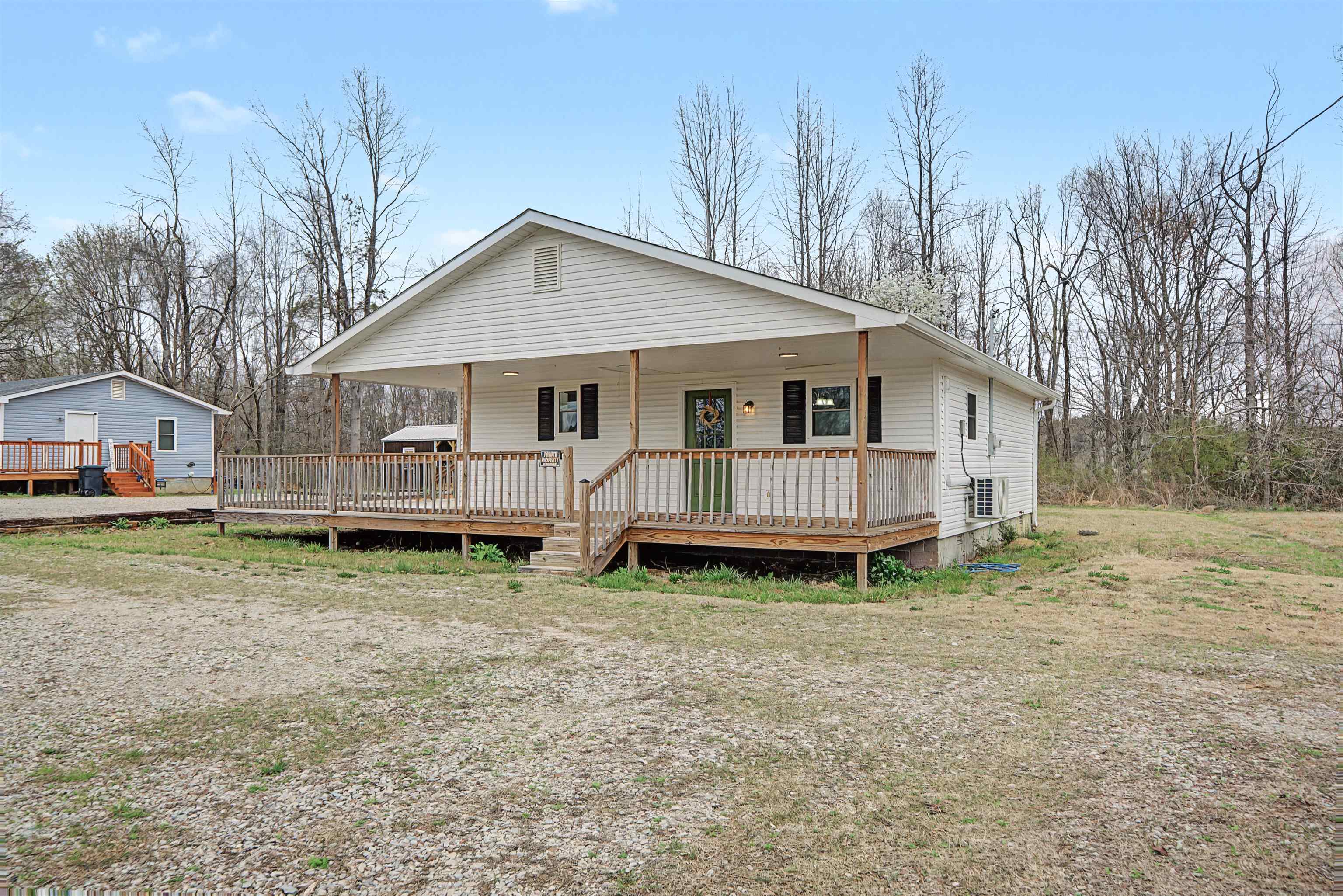8040 45th Highway South Ramer, TN 38367 - Photo 3 of 20 a backyard of a house with yard and trampoline