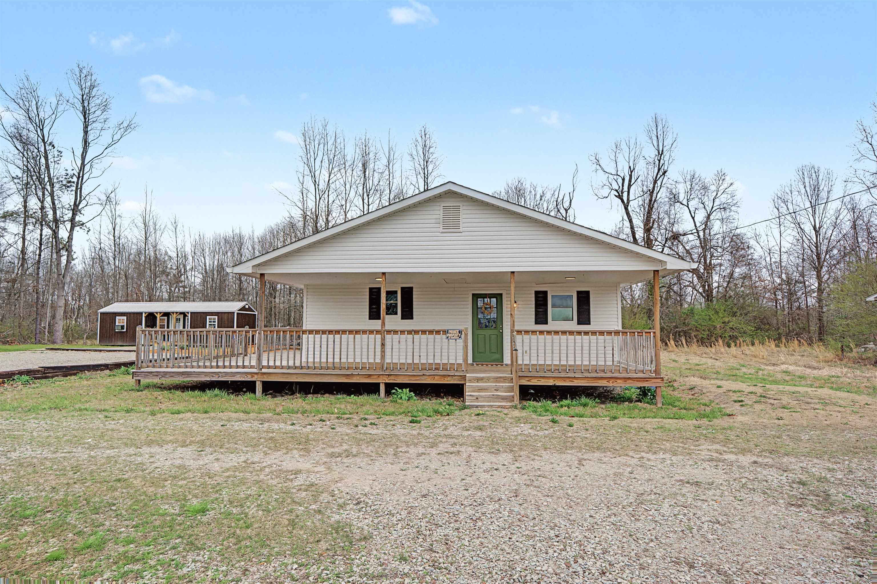 8040 45th Highway South Ramer, TN 38367 - Photo 9 of 20 a front view of a house with a yard and trees