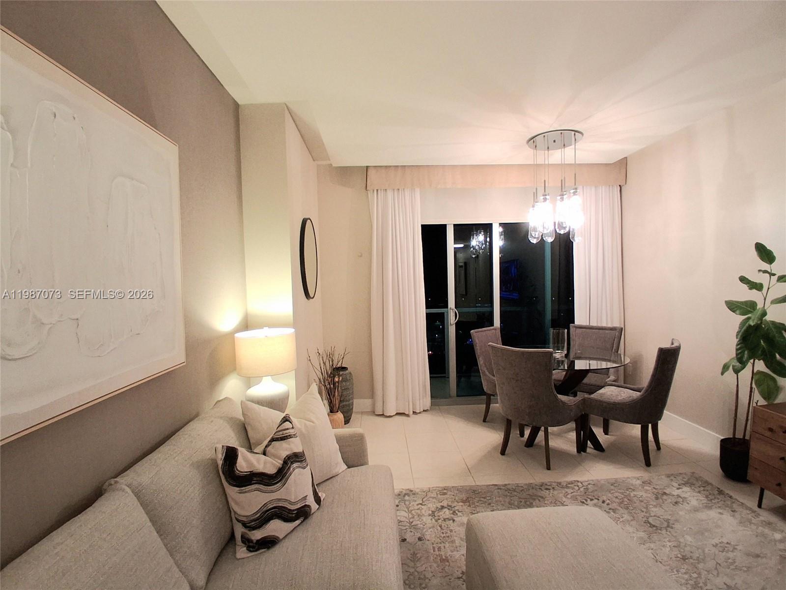 2641 North Flamingo Road, Unit 2607N Sunrise, FL 33323 - Photo 20 of 69 a living room with furniture and wooden floor