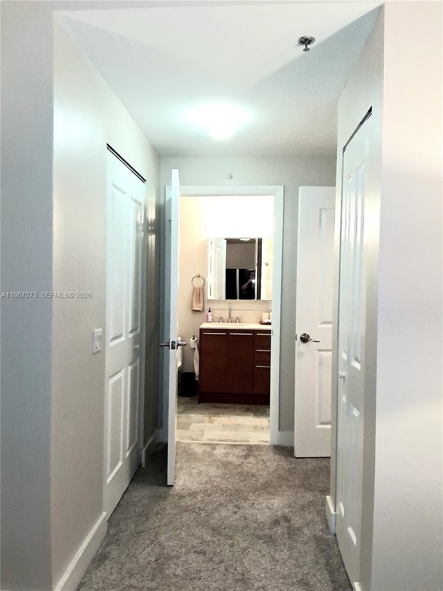 2641 North Flamingo Road, Unit 2607N Sunrise, FL 33323 - Photo 37 of 69 a view of bathroom with sink a mirror and a view of bathroom