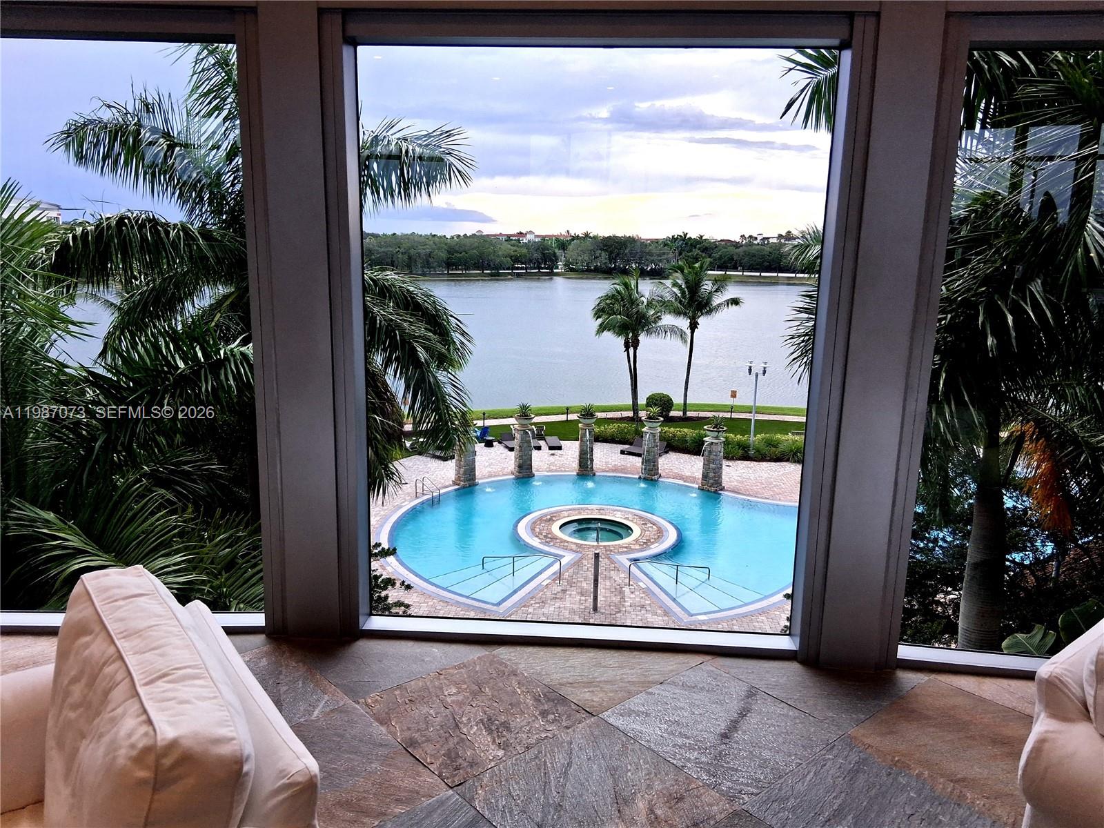 2641 North Flamingo Road, Unit 2607N Sunrise, FL 33323 - Photo 56 of 69 a view of a balcony with chair and table