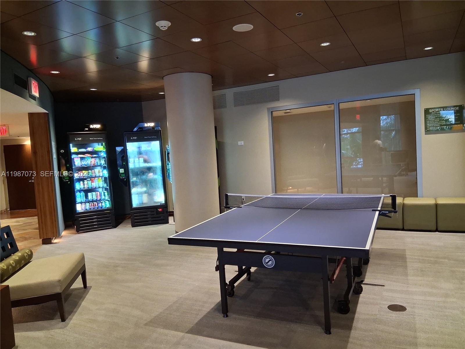 2641 North Flamingo Road, Unit 2607N Sunrise, FL 33323 - Photo 60 of 69 a patio with table and a flat screen tv