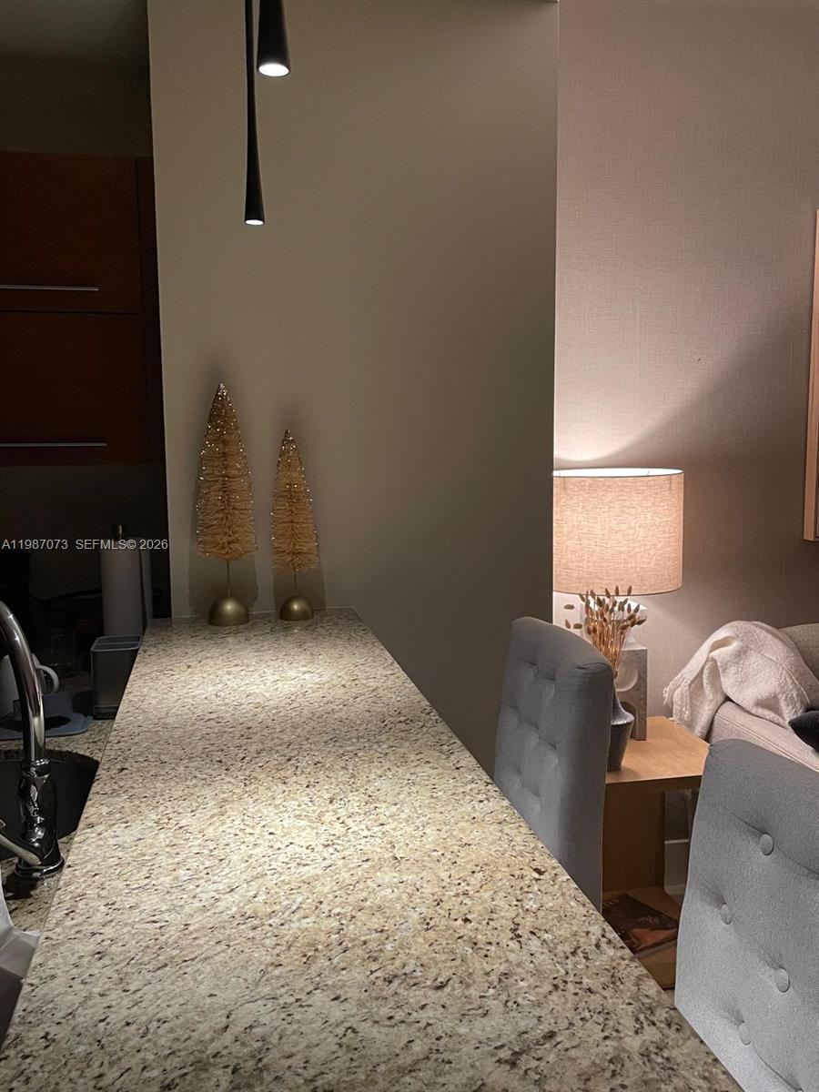 2641 North Flamingo Road, Unit 2607N Sunrise, FL 33323 - Photo 8 of 69 a bedroom with a bed and a window
